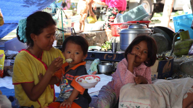 Child being fed after Indonesia earthquake and tsunami