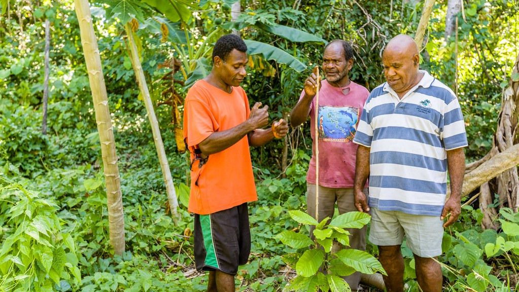 Moli sharing his knowledge with other farmers