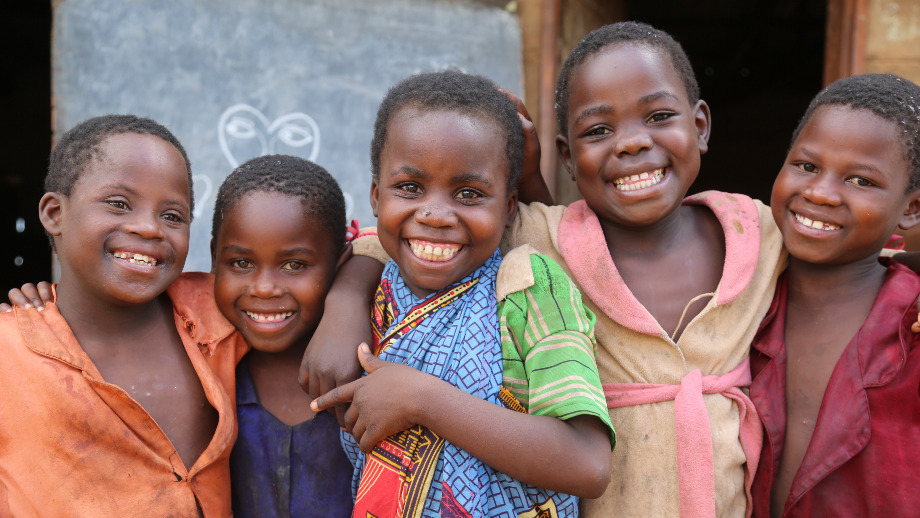 Five children smiling together